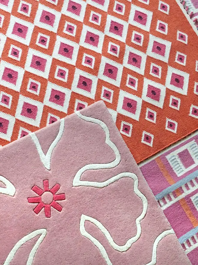 Evil Eye Flatweave Rug, a colourful rug on a plain surface. 