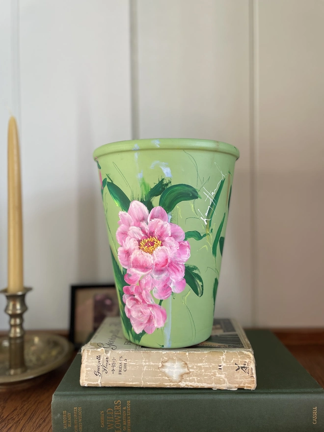  terracotta plant pot hand painted floral terracotta plant pot green background with pink peony flowers.