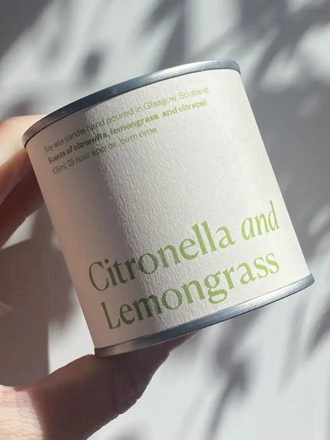 Citronella and Lemongrass Soy Wax Candle Candle, held against a white background. 
