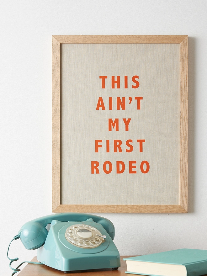 This ain't my first rodeo natural linen print with orange typography
