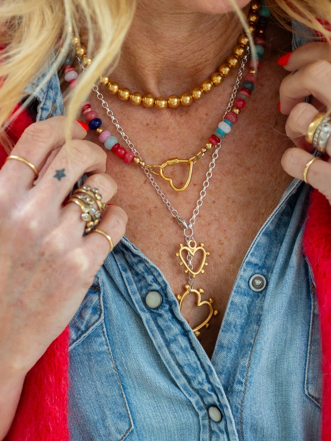 Add impact to your jewellery stack with the Belong Together Lariat Necklace. This mixed metal Y necklace features two studded heart charms that symbolise connection and individuality. Lightweight yet powerful, it’s a modern heart necklace made for layering, gifting or wearing solo with confidence.