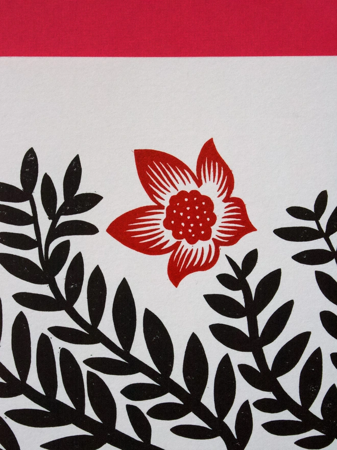 Handmade linocut print of milkweed flowers printed in red and black ink