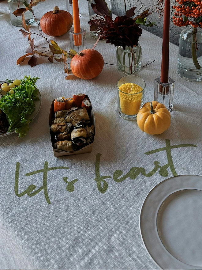 lets feast in green vinyl tablecloth
