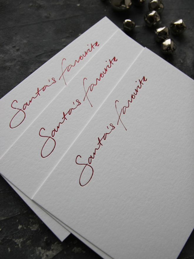 christmas notecard hand foiled in red, says Santa's Favourite, envelope with North Pole Mail hand foiled on it
