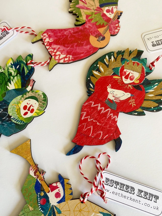 Red and green illustrated angel decoration by Esther Kent