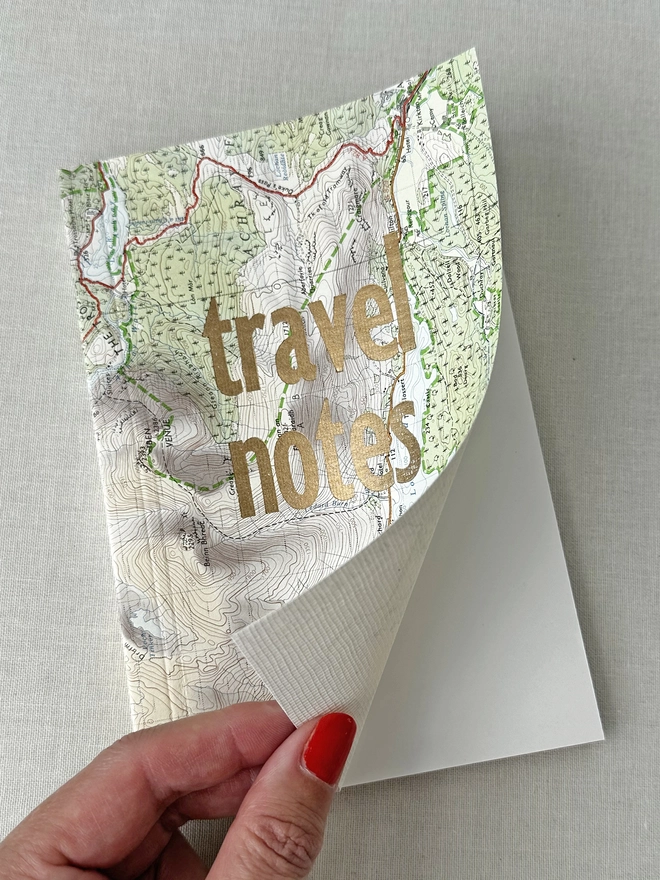 opening the front cover of the map notes book