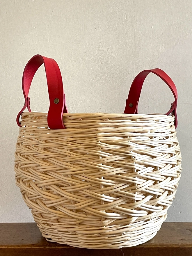 white round willow basket storage basketry one of a kind contemporary natural handcrafted red handles