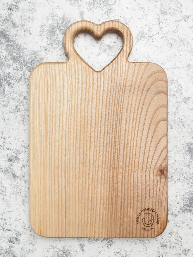 Medium Serving Board, on a marble surface. 
