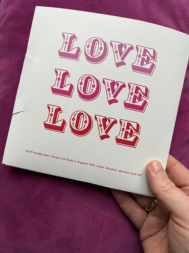 The back of the packaging wallet containing a Mr.PS Love Love Love Handkerchief