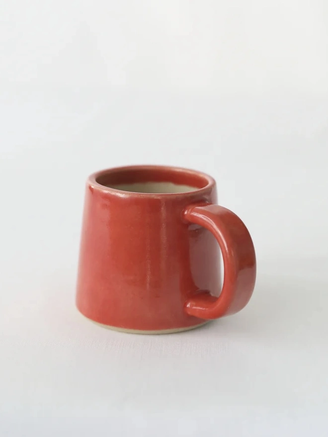 Classic Ceramic Espresso Mug, a colourful ceramic espresso mug sitting on a plain surface against a white backdrop. 