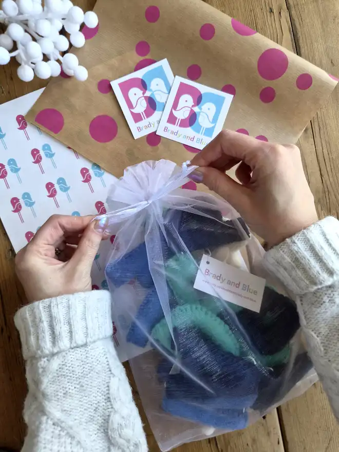 Happy birthday garland packaged in an organza bag.
