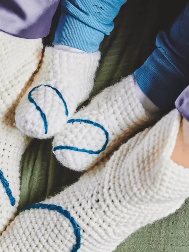 Baby booties with heart embroidery