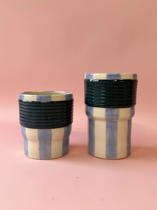     Large and small blue striped ceramic tumblers