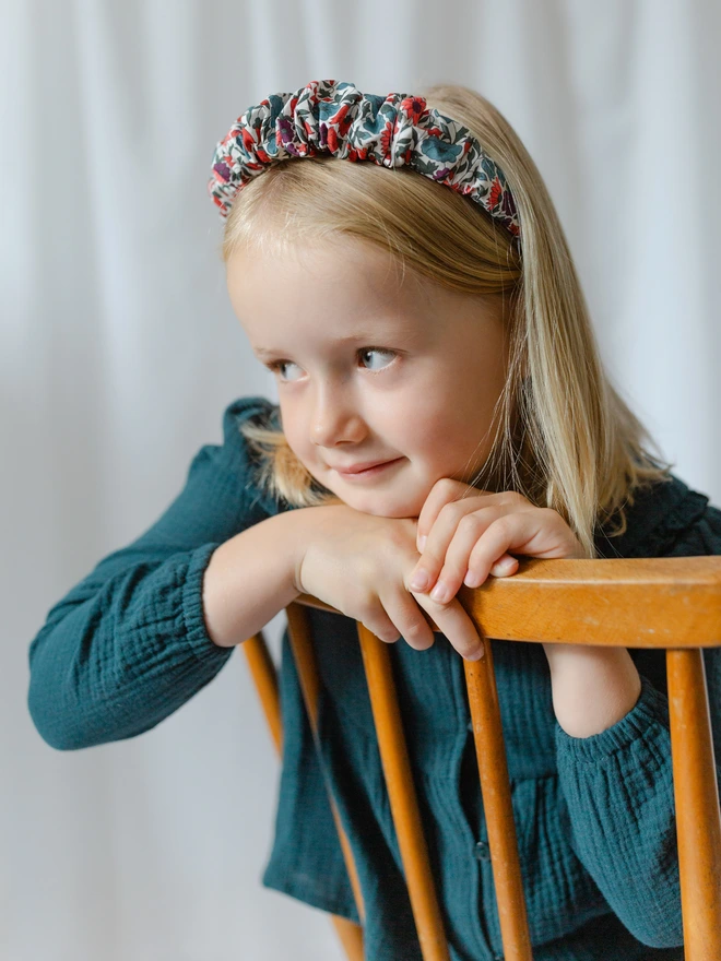 Girl wearing her liberty ruffled hairband alice band