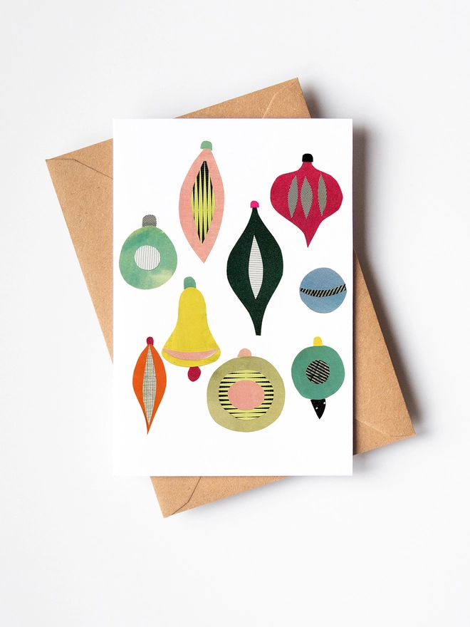 A Christmas card featuring a collection of colourful mid century baubles.
