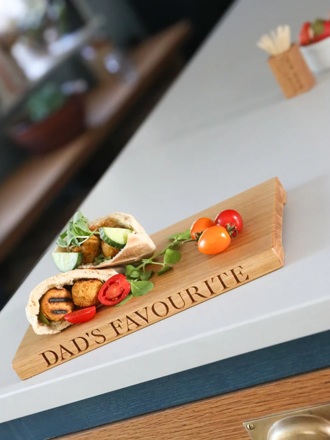 'Dad's Favourite' Oak Chopping Board on a kitchen counter