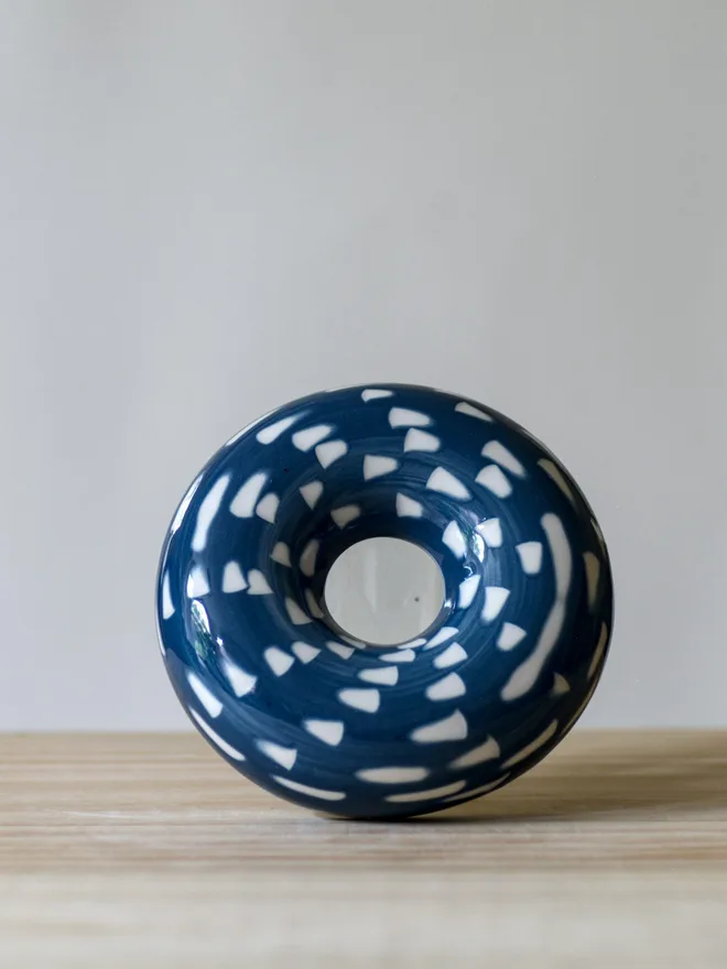 Handmade porcelain avocado planter with carved blue pattern, designed to hold an avocado seed for sprouting