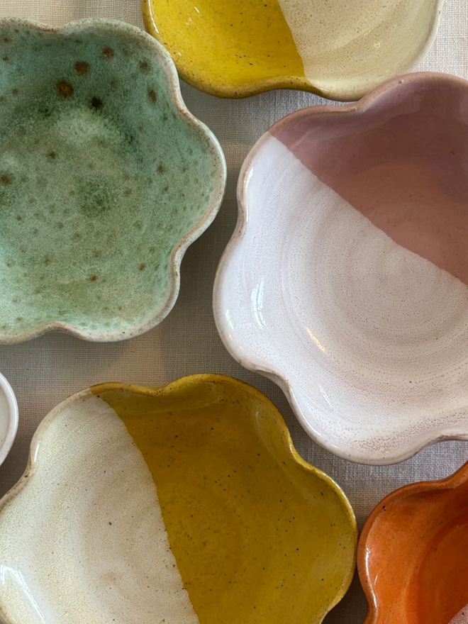 Mini Frilly Dish. A birds-eye view of five frilled dishes, of pink, orange, yellow, and green.