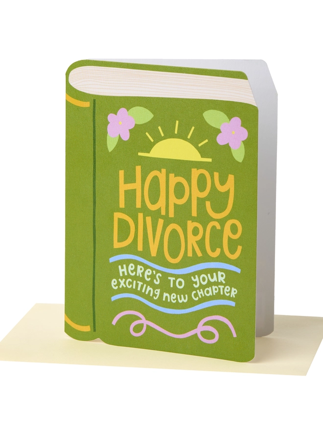 A closed green book featuring the message Happy Divorce, Here's to a new exciting chapter