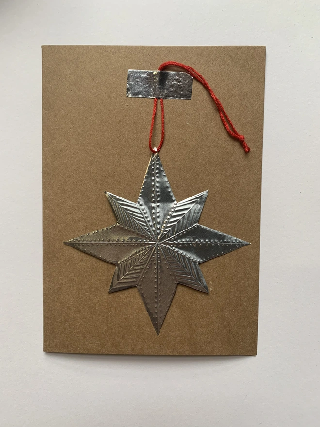 Star embossed tin decoration 