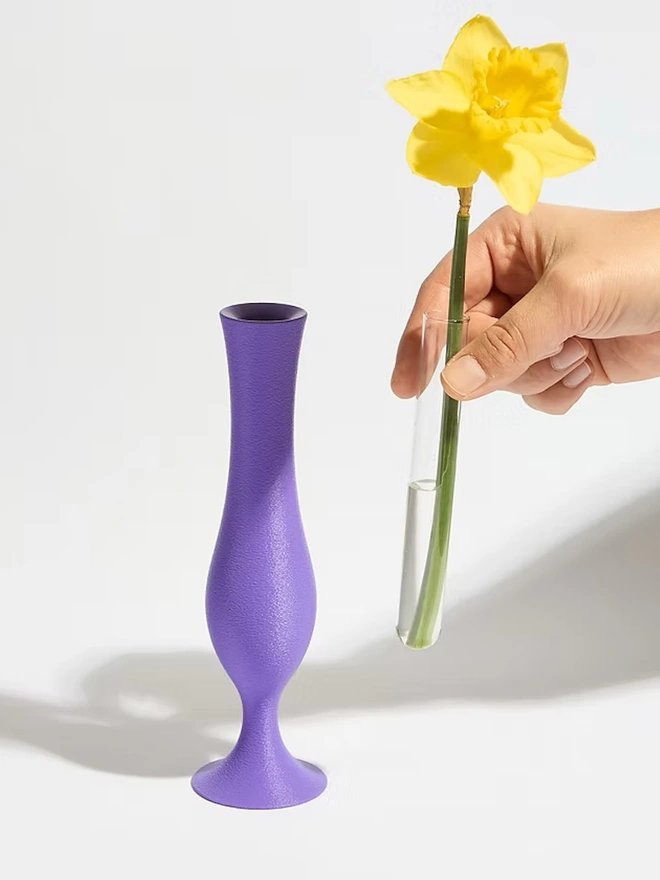 flute shaped 3d printed vase in purple with yellow flower