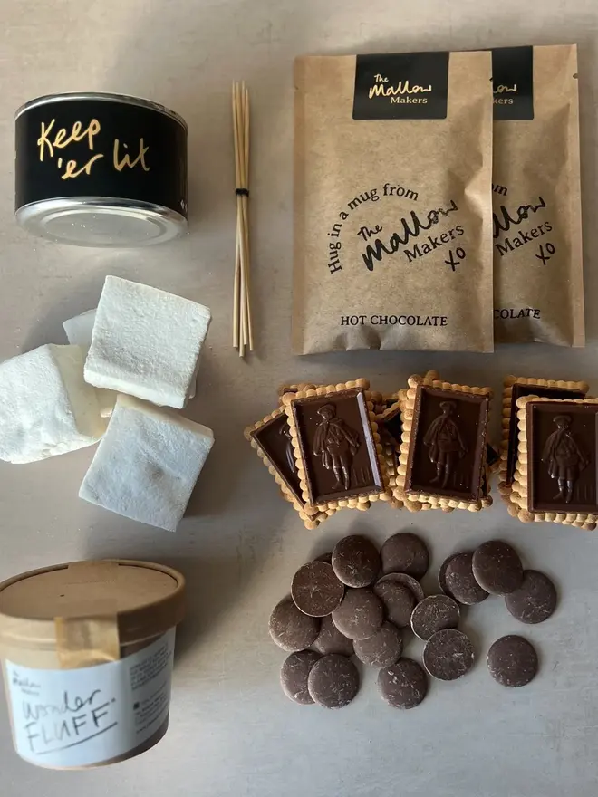 Luxury S'mores & Hot Chocolate Kit, the kit laid out on a marble surface. 