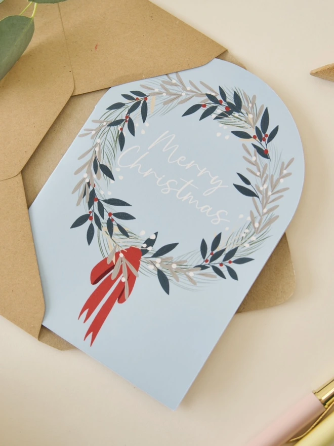 Botanical Wreath merry Christmas card with blue background
