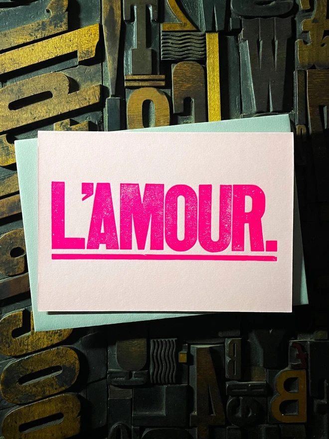 L’Amour! A beautiful wooden type letterpress card printed with rich fluorescent pink ink on thick Candy Pink card with a luxury matching envelope; ideal to send a to a friend or loved one.