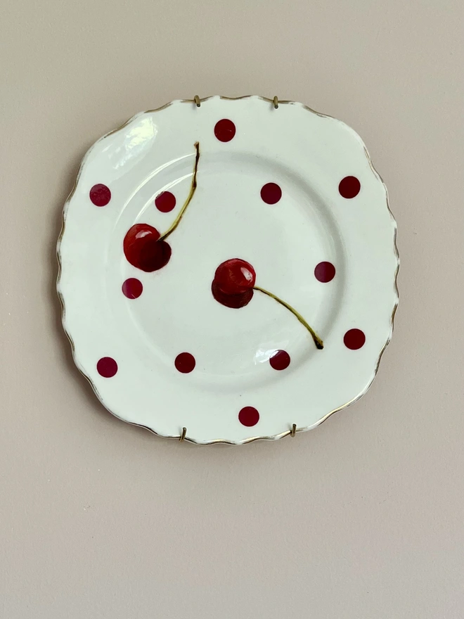 cherry painting on vintage polka dotted plate