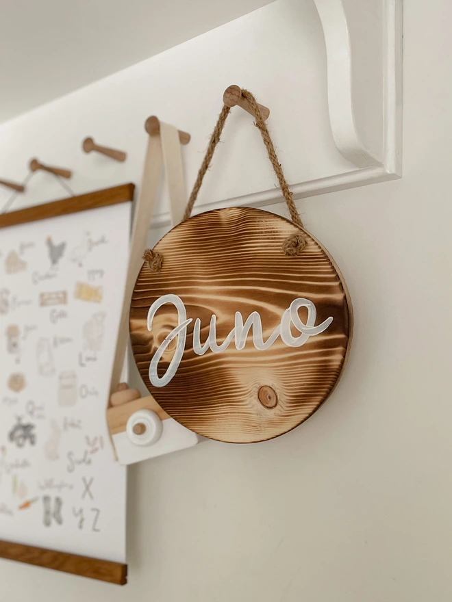 round wooden name sign