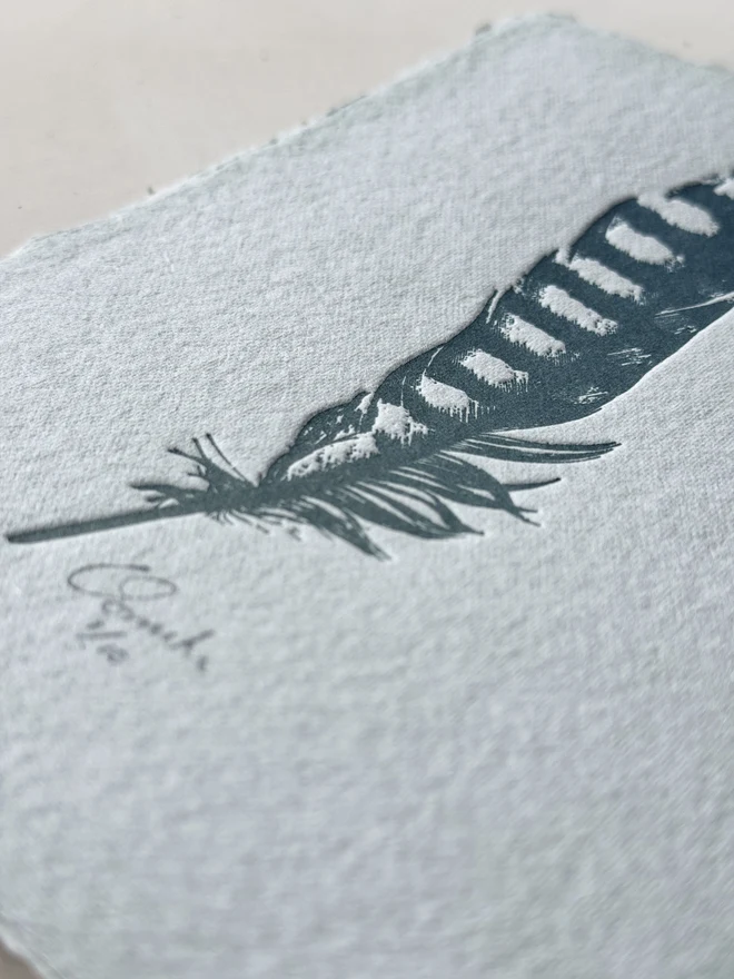 Letterpress feather print on handmade paper
