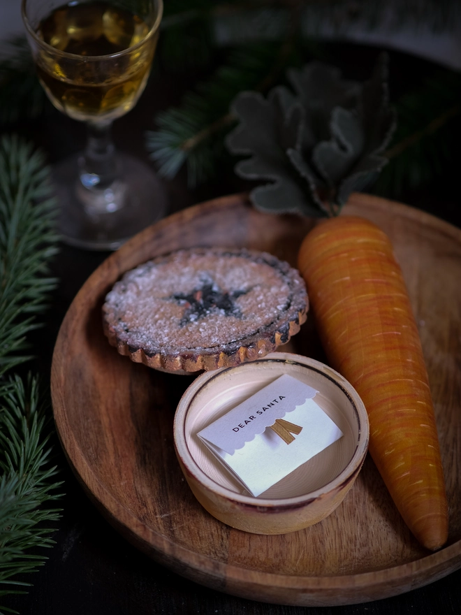 A festive handpainted wooden mince pie designed to become part of your family’s Christmas Eve tradition, with a special place for a note to Santa.