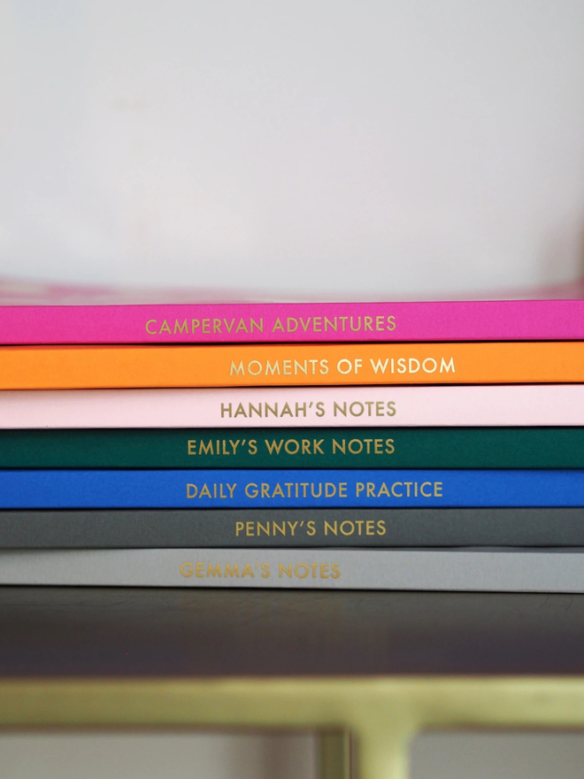 personalised gold foil a5 notebook. coloured notebooks with gold personalisation on the spine.
