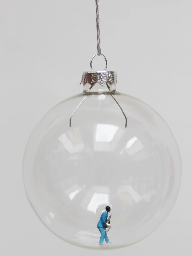 Miniature figure of Jazz Saxophonist in a glass Christmas bauble