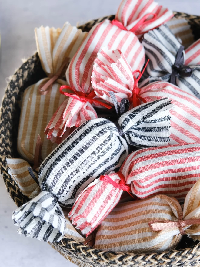 A bowl of fabric humbug wedding party favours