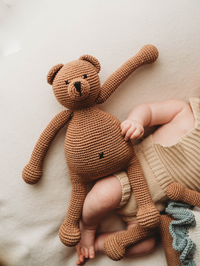 handmade brown crochet teddy bear lifestyle shot