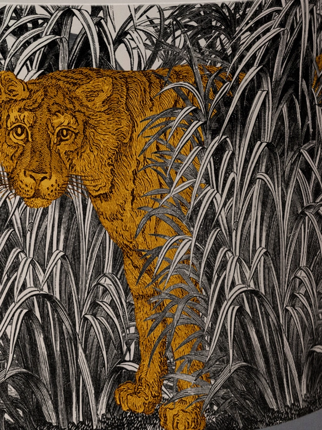 A decorative lampshade featuring an elegant tiger moving through tall tropical grasses, inspired by Henri Rousseau’s jungle paintings, with a rich botanical design.