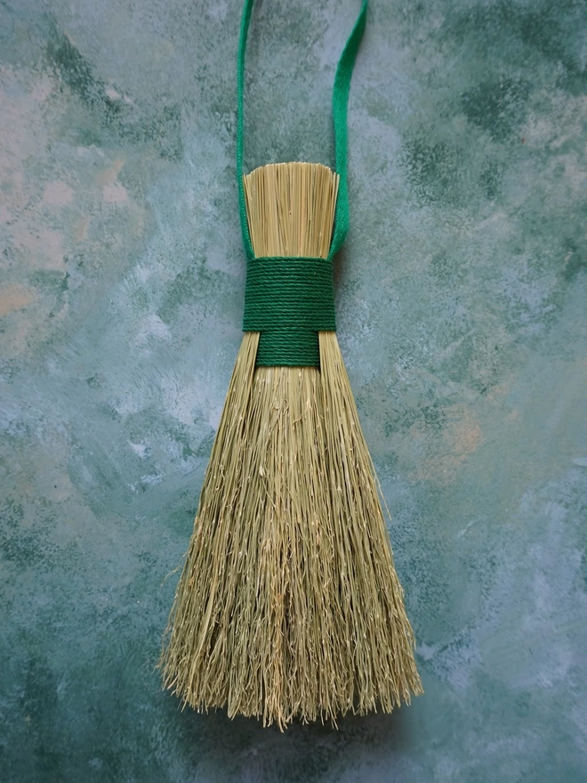 Handmade broomcorn bundle brush with green hemp cord binding