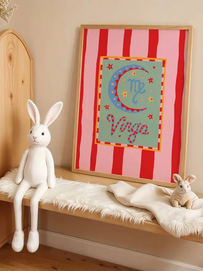 Pink and red striped virgo print in a frame on a children's bedroom shelf horoscope print 