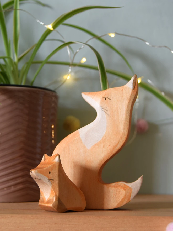 wooden toy snuggling foxes