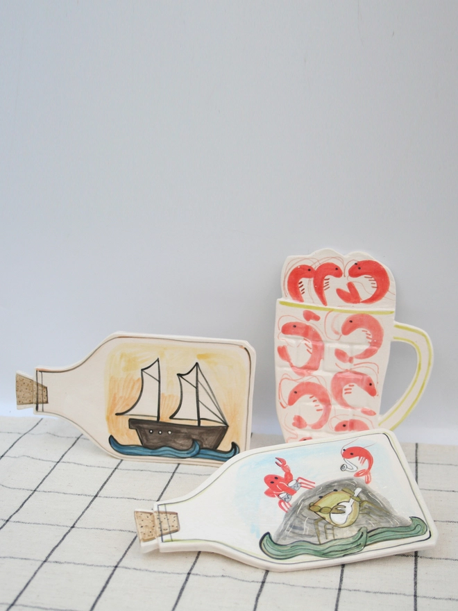 handmade ceramic wall art, seaside, ship in bottle, prawns, ceramic prawns, ceramic, crab band, wall hanging, fun ceramics