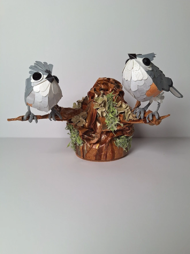 Tufted Titmice on a trees tump handmade bird sculpture