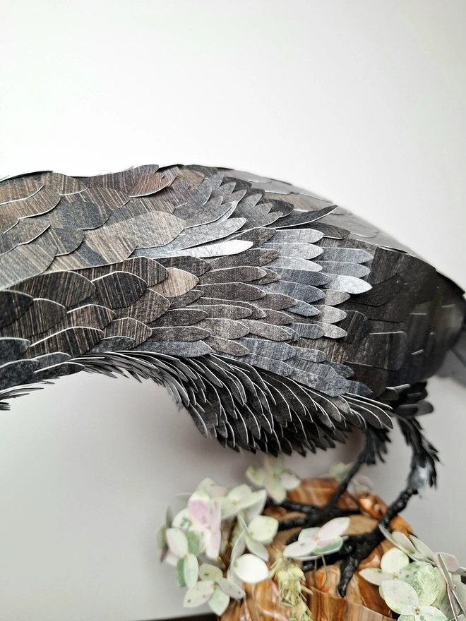 Detail of the handcut feathers on the rav3nmpaper sculpture 