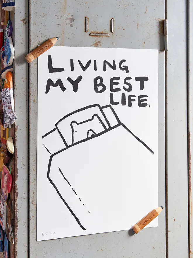 'Living my best life' magnets holding it up against a metal cabinate 