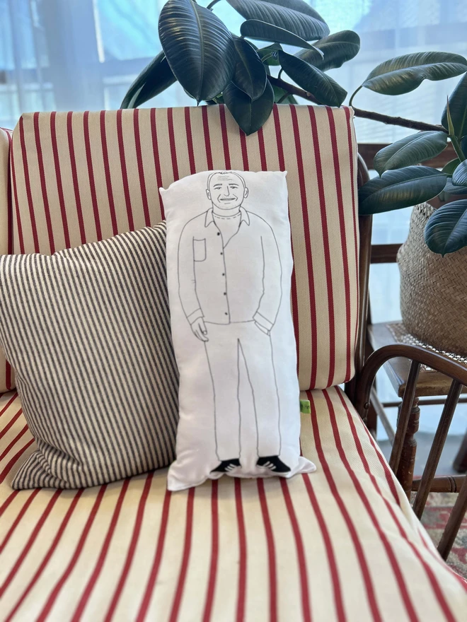 Illustrated cushion featuring Bob Mortimer