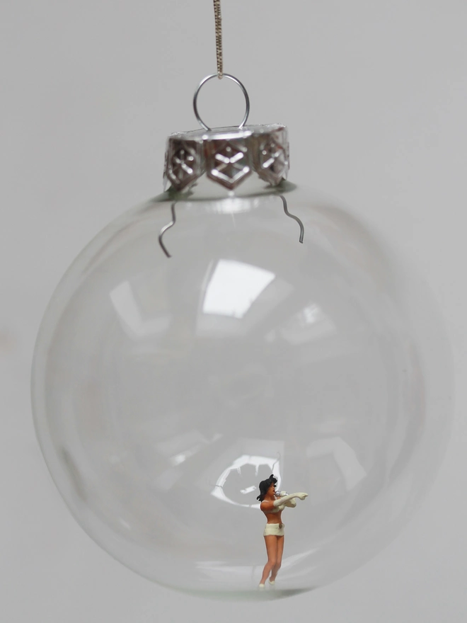 Miniature figure of a lead singer in a glass Christmas bauble 