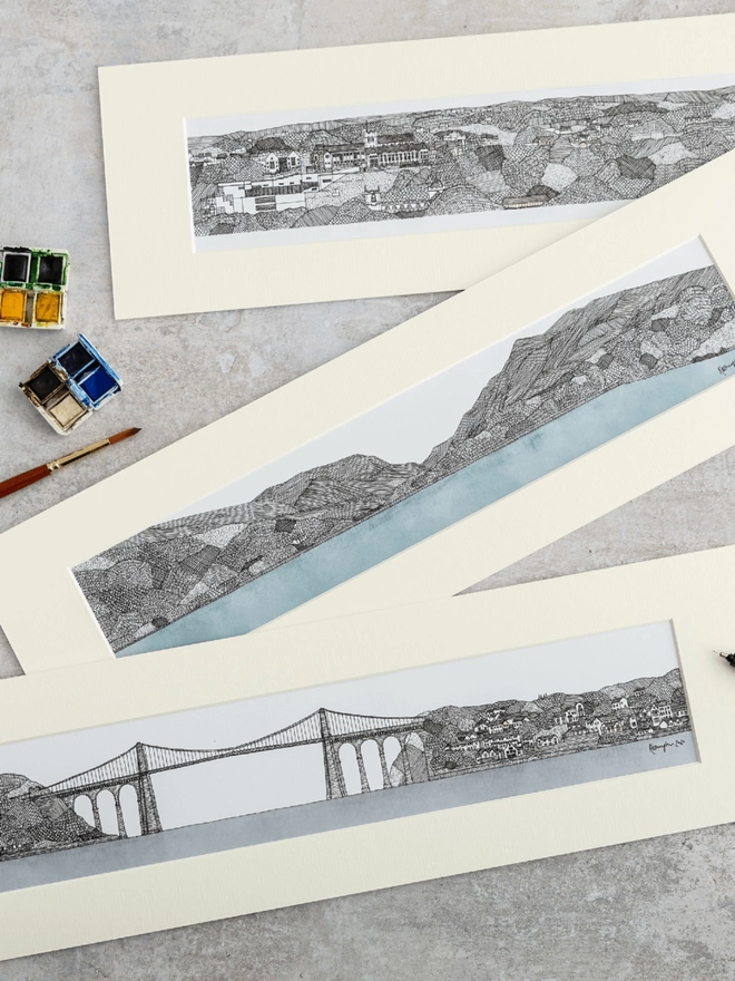  Prints of detailed pen and watercolour drawings of Bangor seafront, Eryri: Llyn Padarn, Snowdonia and the Menai Bridge, in soft white mounts