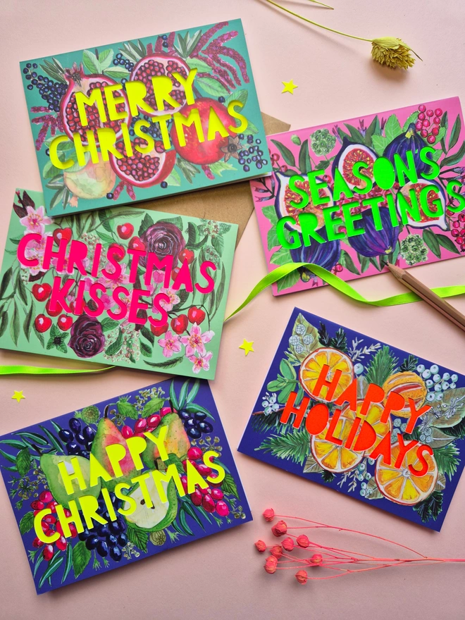 Multipack of Christmas card with five designs-Merry Christmas pomegranate, Season's greetings figs, Happy Christmas Pears, Happy Holidays Oranges, Christmas Kisses Cherry