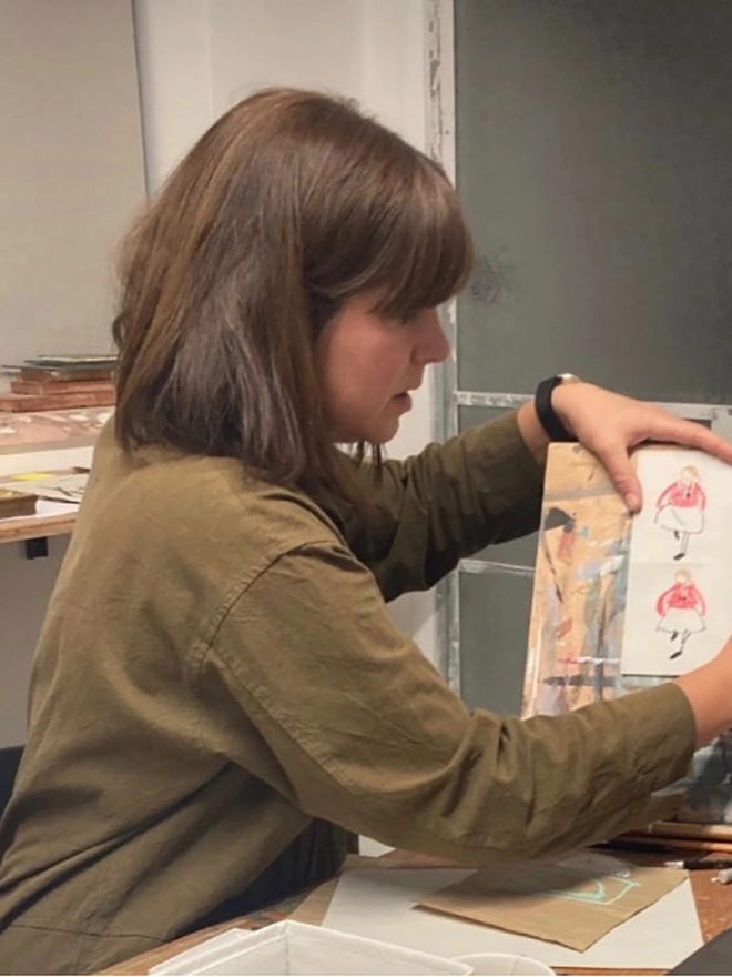 artist working at drawing board