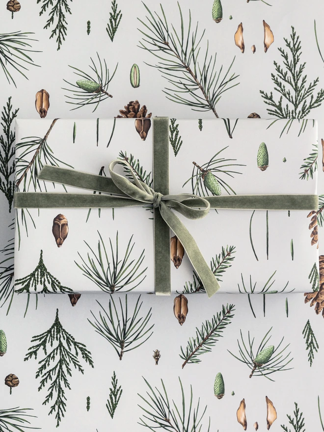 Grey based christmas wrap with festive tree botanical elements